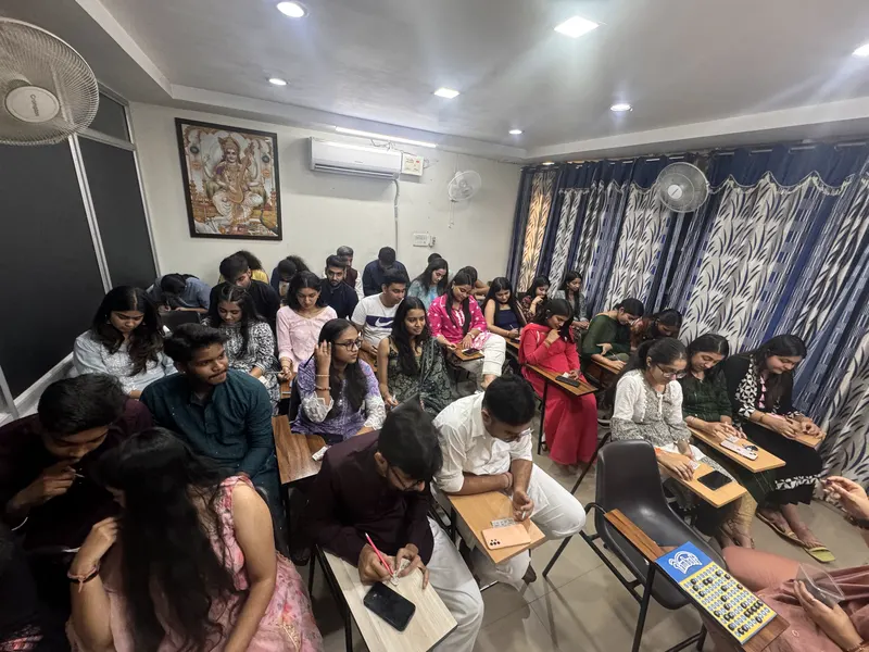 People seated in a classroom in festive clothing