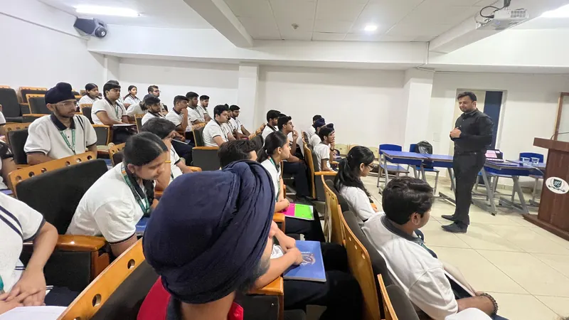 Rows of seated students listening to Anshul Wadhwa at the front of the room