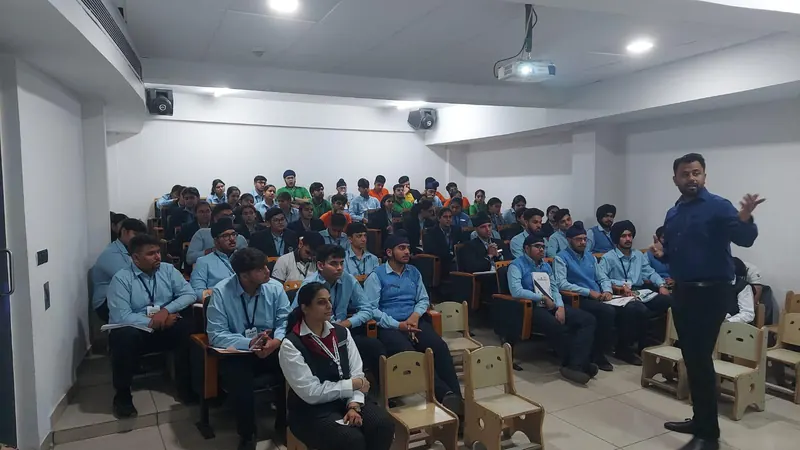 A seated student group facing Anshul Wadhwa as he speaks