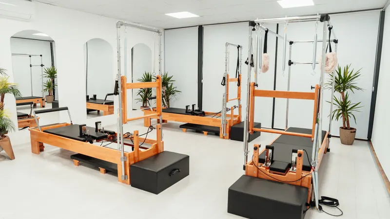 Exercise equipment with wooden platforms and springs in a bright room