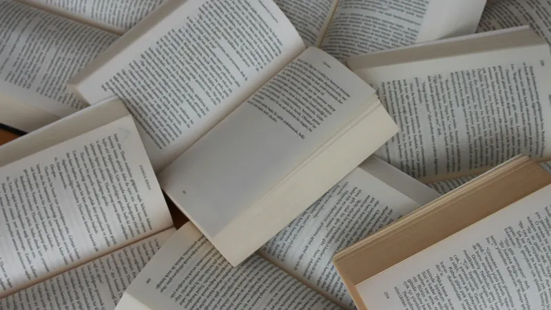 Open books arranged with overlapping pages seen from directly above