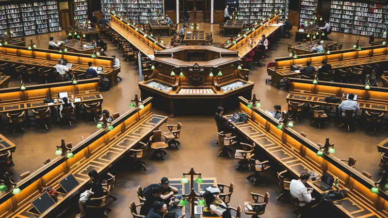Tiered library reading desks arranged around a circular central opening